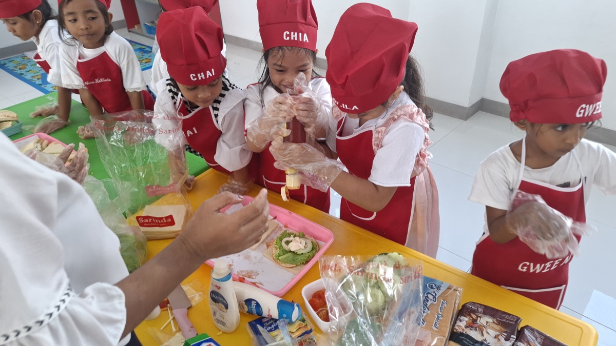 Students making food in cooking class