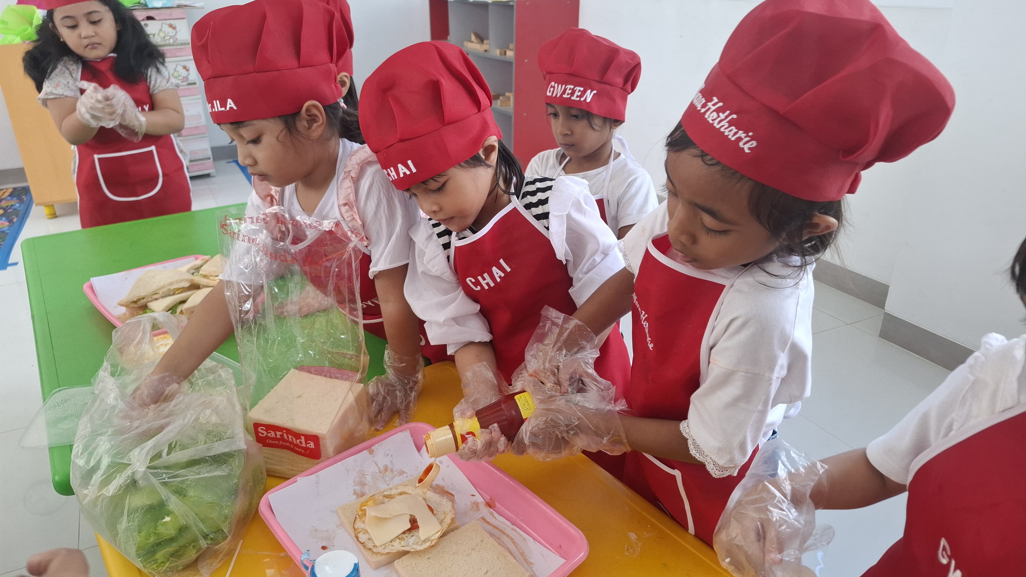 Little chefs making sandwiches