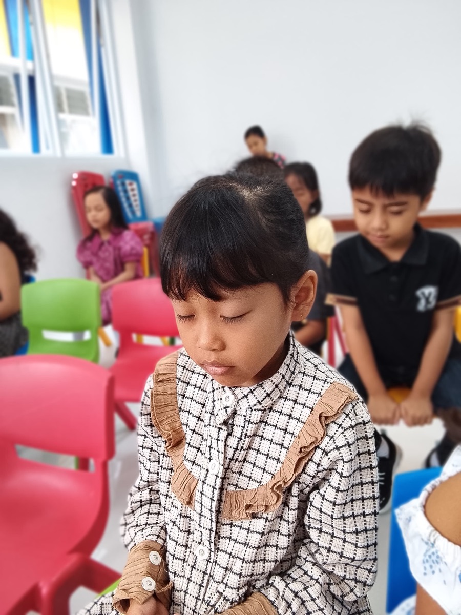 Student praying at Sekolah Rajawali Bangsa